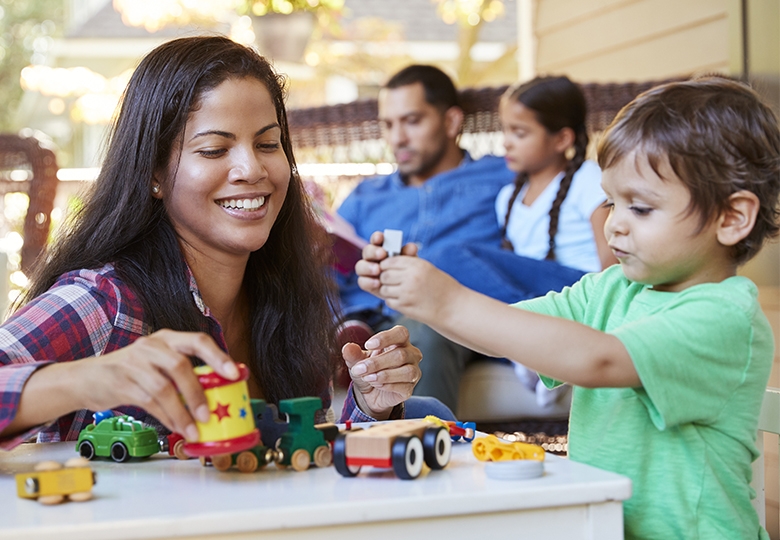 Adults playing with discount legos